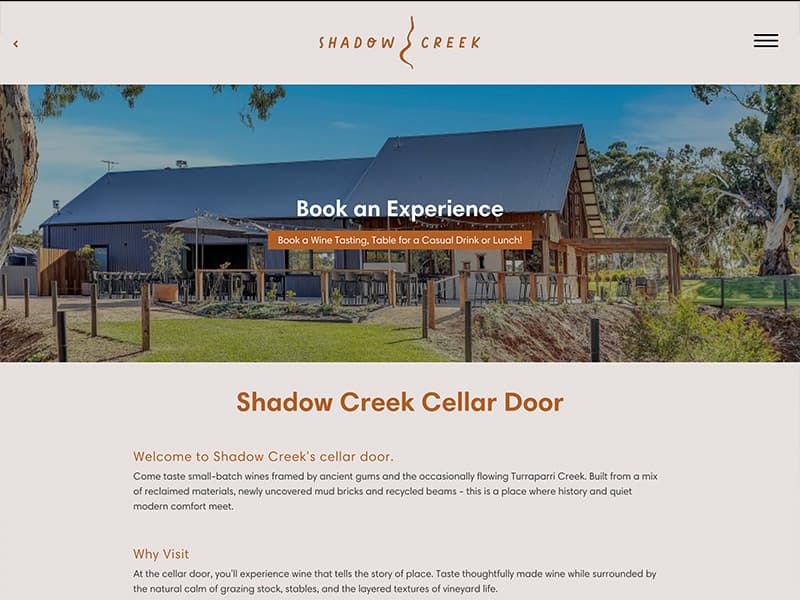 Shadow Creek Winery cellar door page with close-up vineyard grapevine imagery