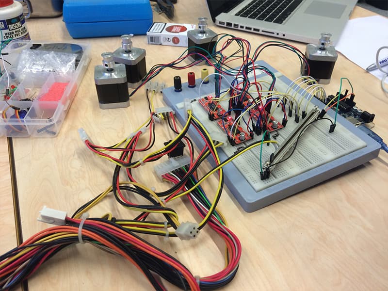 Arduino breadboard wiring powering the stepper motors in the gear installation